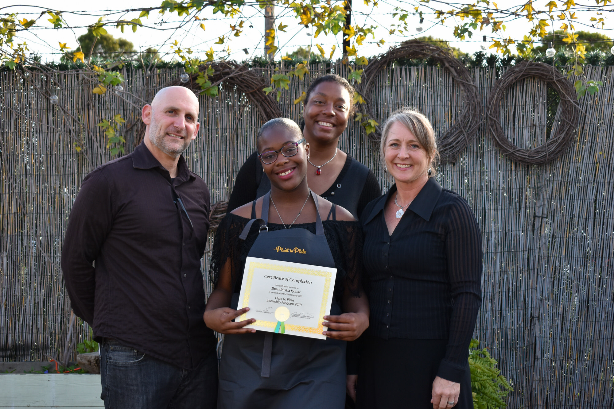 attendee holding a diploma